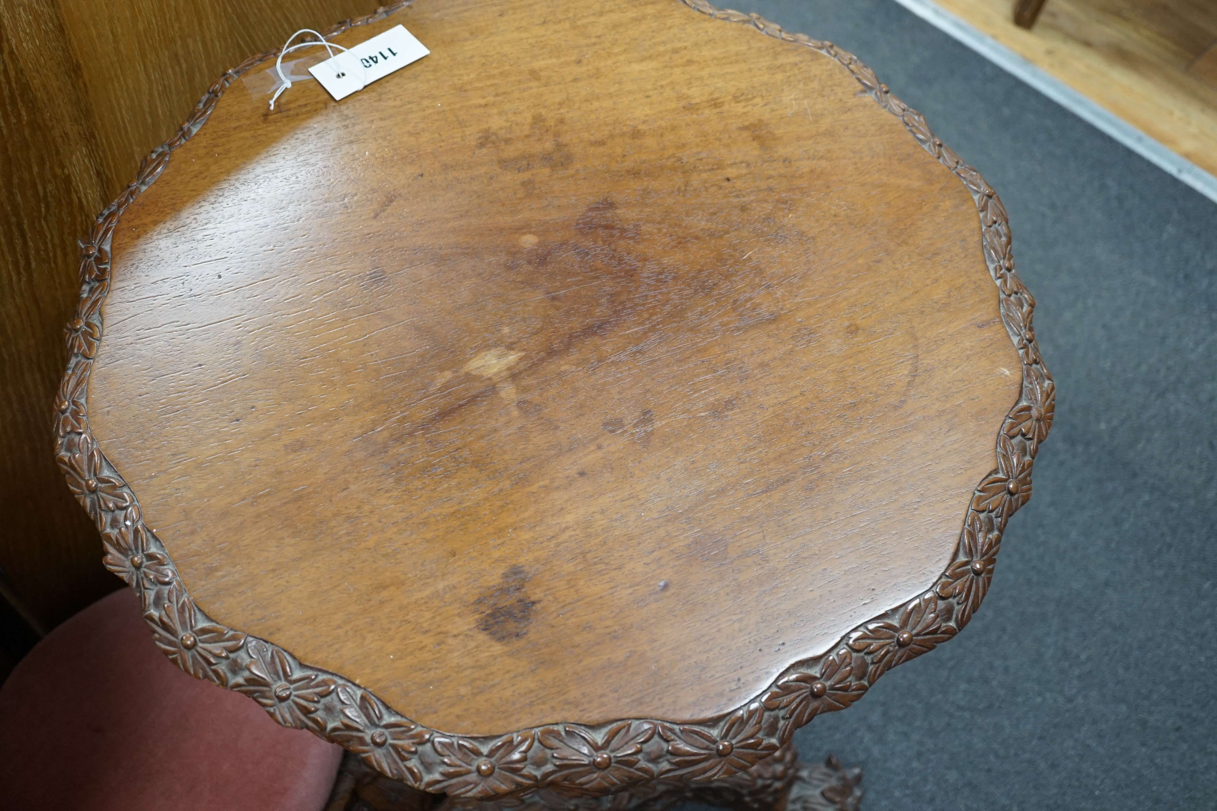 A Burmese carved hardwood circular occasional or centre table, diameter 57cm height 74cm, together with a similar side chair and foot stool